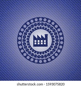 factory icon inside badge with denim texture