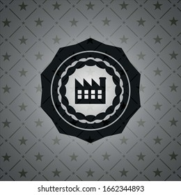 icono de fábrica dentro del emblema negro