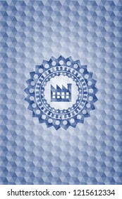 factory icon inside blue badge with geometric background.