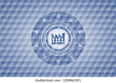 factory icon inside blue emblem or badge with geometric pattern background.