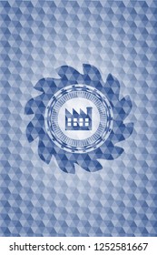 factory icon inside blue emblem with geometric pattern.