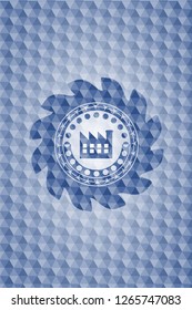 factory icon inside blue emblem or badge with abstract geometric pattern background.