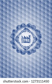 factory icon inside blue emblem or badge with geometric pattern background.