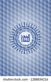 factory icon inside blue emblem or badge with geometric pattern background.