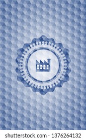 factory icon inside blue hexagon emblem.