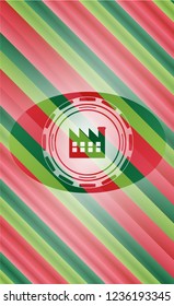 factory icon inside christmas colors badge.