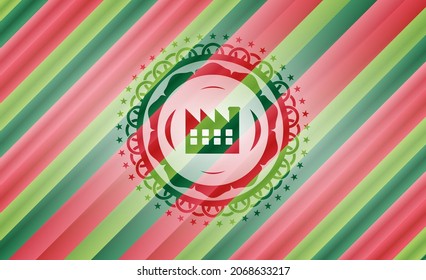 factory icon inside christmas colors emblem. 