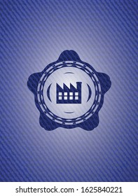 factory icon inside emblem with jean background