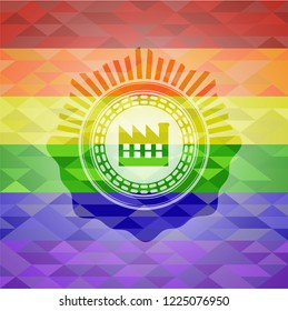 factory icon inside emblem on mosaic background with the colors of the LGBT flag