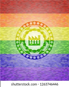 factory icon inside emblem on mosaic background with the colors of the LGBT flag
