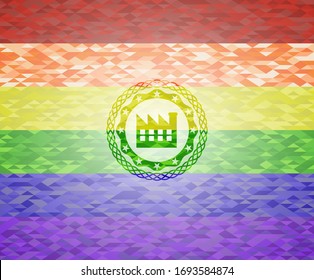 factory icon inside emblem on mosaic background with the colors of the LGBT flag