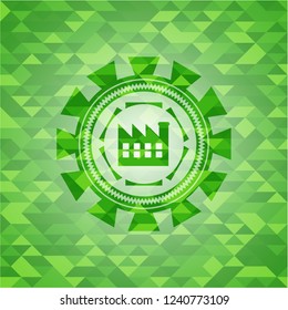 factory icon inside green emblem. Mosaic background