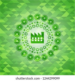 factory icon inside green emblem with triangle mosaic background