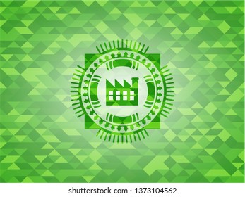 factory icon inside green emblem with mosaic background