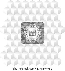 factory icon inside grey badge with geometric cube white background