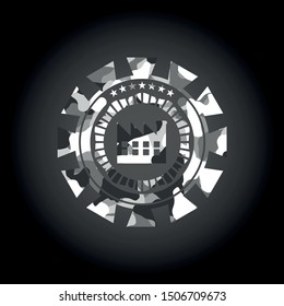 factory icon inside grey camouflaged emblem