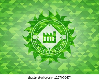 factory icon inside realistic green mosaic emblem