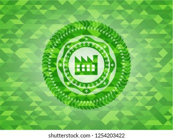 factory icon inside realistic green mosaic emblem