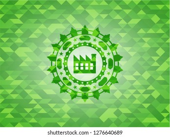 factory icon inside realistic green emblem. Mosaic background