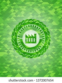 factory icon inside realistic green mosaic emblem