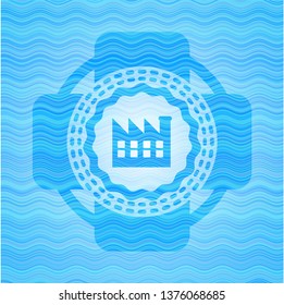 factory icon inside water concept badge.