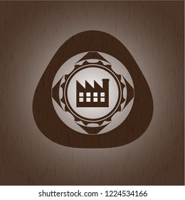 factory icon inside wooden emblem