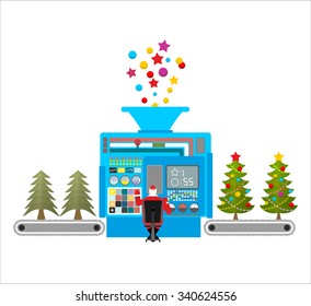 Factory machine for release of beautiful Christmas trees. Tree for new year with ball and star. Xmas decorations are automatically attached to spruce. Automatic fir-tree decorating