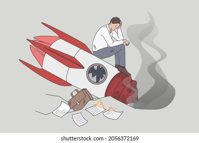 Failed and crashed business rocket startup. Vector concept illustration of sad business manager standing on broken launching missile.