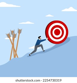 failure or obstacle, missed target, difficulty in working hard to achieve target or setting too high or unrealistic goal concept, businessman trying hard to push dartboard or arrow target up hill.