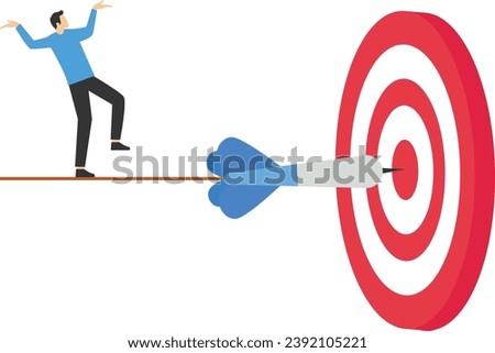 failure or obstacle, missed target, difficulty in working hard to achieve target or setting too high or unrealistic goal concept, businessman trying hard to push dartboard or arrow target up hill.


