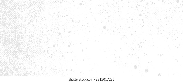 Faint gray speckle pattern on white background with denser texture on left abstract
