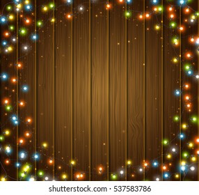 Fairy lights for festive decoration, realistic luminous bulbs. Colourful glowing Christmas round garland on wooden texture. Light effects for New Year greeting cards.. Vector illustration