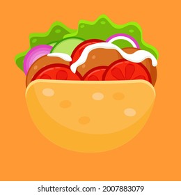 Falafel in a pita with vegetables. a tomato. onions, cucumbers and yogurt
