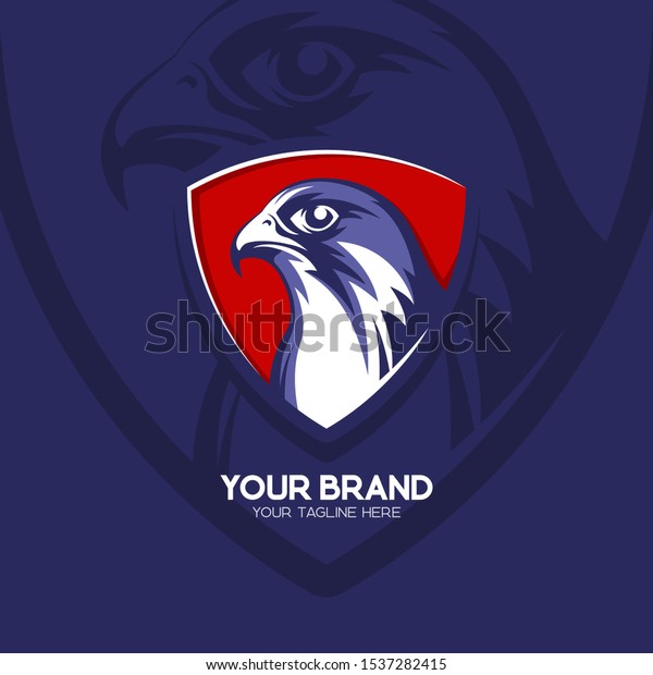 Falcon head logo badge in blue & red color.\
Eagle esport emblem. Hawk logo illustration. Falcon head with\
triangle shield. Eps10.