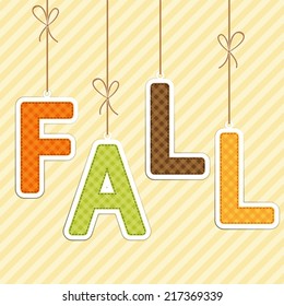 FALL background as retro fabric letters on strings in autumn colors