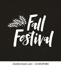Fall Festival - hand drawn lettering phrase with wheat. Harvest fest poster design. For invitation cards, banner, print, brochures, poster, t-shirts, mugs. Vector illustration on black background.