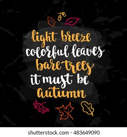 Fall handwritten brush calligraphy quote and autumn motives. Lettering and decorative leaves. Vector element for your design on chalkboard dark background.
