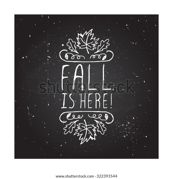 Fall is here.\
Hand-sketched typographic element with maple and oak leaves on\
chalkboard background. 