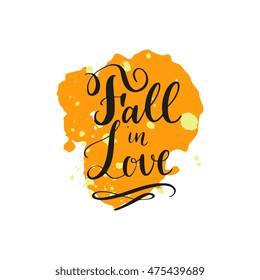 Fall in Love saying in modern calligraphy style with ink stains, blobs and strokes, isolated on background. Quote for postcard, banner, wall decor, flyer, greetings. Handdrawn trendy organic design