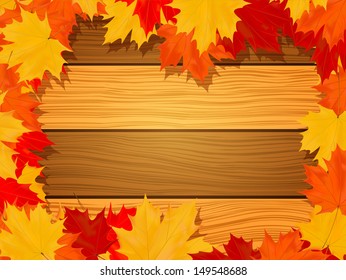 fall maple leaves on wooden planks