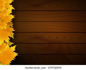 Fallen autumn leaves on the wooden background