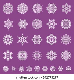 Falling Christmas stylized snowflakes. Set of beautiful vector snowflakes isolated on a purple background. Snowflakes, snowfall, doodles, abstract.