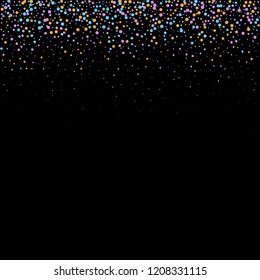 falling colored circles on a black background