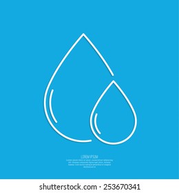 Falling drop of water on a blue background. 
