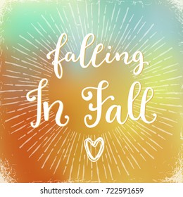 Falling in Fall. hand lettering calligraphic word. greeting card template, vector typographic illustration with handwritten words about autumn on a blurred background