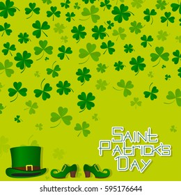 Falling leaves of the clover and the inscription of St. patrick's day