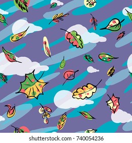 falling leaves on a background of clouds the sky and rain