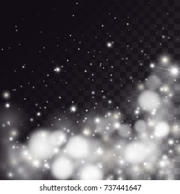 Falling light particles on transparent background. White bokeh and sparkles, magical snow effect.