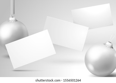 Falling New Year greeting cards and Christmas balls. Template for a festive design with realistic shadows