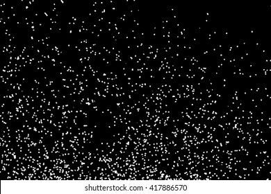 Falling snow or night sky with stars pattern. Black and white hand drawn blow spray or splash monochrome sparkle texture. White spots or stars on dark sky at night.  Abstract falling snow backdrop.